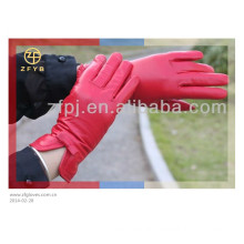 woman custom made putting on leather gloves